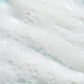 Close-up of white, foamy cleanser with small bubbles